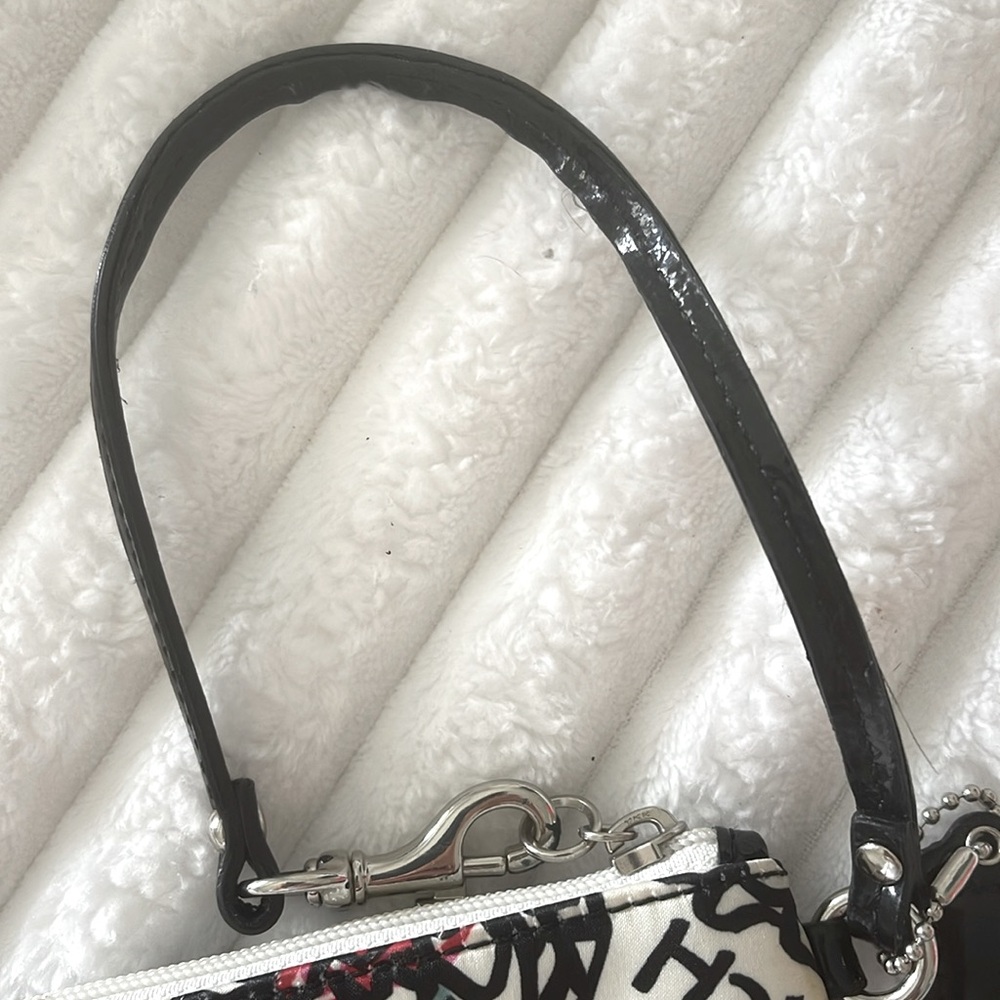 Coach Poppy Floral Wristlet with Black and Red Accents EUC
No Callouts - Picture 7 of 10